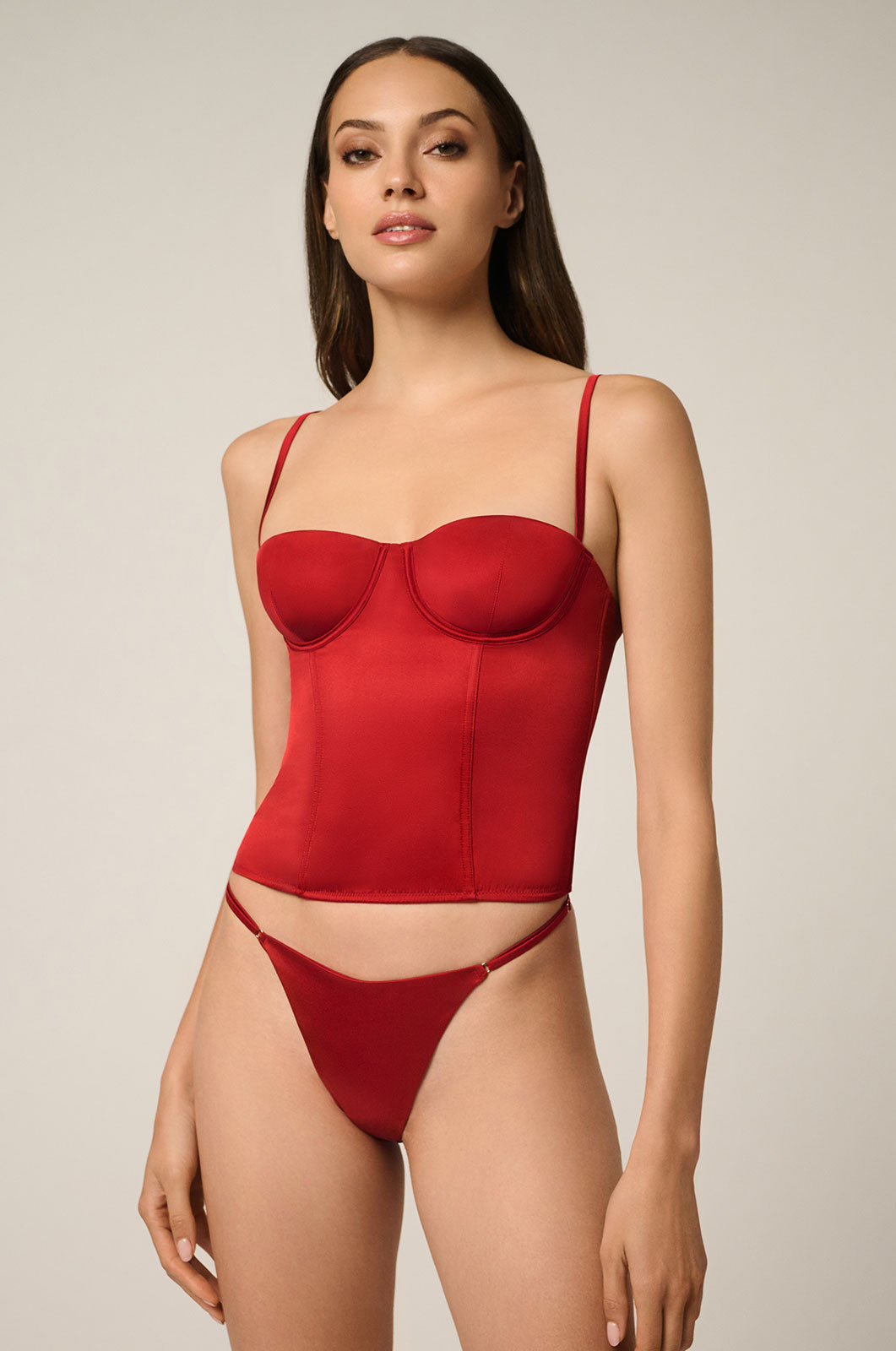 Silk stretch bustier top with adjustable straps, hook, and eye back closure